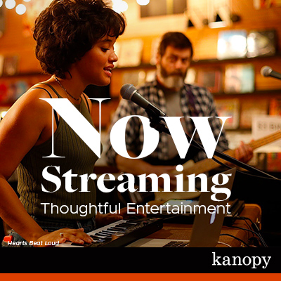 Now Streaming Thoughtful Entertainment. Kanopy. A scene from the film Hearts Beat Loud. A young woman sings and plays the keyboard while her father play guitar and looks on. They are performing together in a record store.